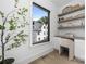 Bright home office with custom built-in shelves and desk space next to a large window view at 614 Queens Rd, Charlotte, NC 28207