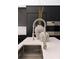 Modern kitchen featuring stainless steel appliances, marble countertops and decorative vases at 614 Queens Rd, Charlotte, NC 28207