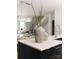 Modern kitchen island with stainless steel sink, marble countertop, and decorative vases at 614 Queens Rd, Charlotte, NC 28207