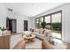 Comfortable living room with large sliding doors to outdoor area, stylish furniture, and neutral decor at 614 Queens Rd, Charlotte, NC 28207
