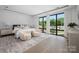 Spacious main bedroom has a large rug, sitting area, and oversized windows with natural light at 614 Queens Rd, Charlotte, NC 28207