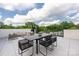 Large rooftop deck with seating and dining areas offer an amazing outdoor living space at 614 Queens Rd, Charlotte, NC 28207