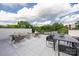 Expansive rooftop deck with dining and lounge areas perfect for entertaining and relaxing at 614 Queens Rd, Charlotte, NC 28207
