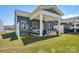 Spacious backyard showcasing a covered patio, ideal for outdoor gatherings and leisure at 6295 Ashton Park Dr, Denver, NC 28037