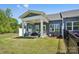Inviting backyard with a covered patio, perfect for outdoor entertaining and enjoying the green space at 6295 Ashton Park Dr, Denver, NC 28037