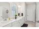 Bright bathroom features double sinks, quartz countertops, and a neutral color palette for a clean, modern aesthetic at 6295 Ashton Park Dr, Denver, NC 28037