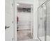Modern bathroom boasts a glass-enclosed shower and an open closet space for easy organization at 6295 Ashton Park Dr, Denver, NC 28037