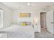 Cozy bedroom with a white headboard, a nightstand, and yellow pillows offering a relaxed ambiance at 6295 Ashton Park Dr, Denver, NC 28037