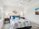 Stylish bedroom featuring a leafy bedspread, a golden art piece, and dual lamps for a tranquil atmosphere at 6295 Ashton Park Dr, Denver, NC 28037