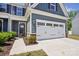 Attractive home exterior with an attached two-car garage and covered front entry at 6295 Ashton Park Dr, Denver, NC 28037
