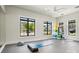 Bright community gym featuring large windows, fitness equipment, and exercise space at 6295 Ashton Park Dr, Denver, NC 28037