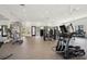 Bright gym featuring modern exercise equipment, weights and fitness machines within a spacious, well-lit area at 6295 Ashton Park Dr, Denver, NC 28037