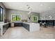 Well-appointed community kitchen with modern appliances, sleek countertops, and ample seating at 6295 Ashton Park Dr, Denver, NC 28037