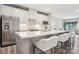Modern kitchen with stainless steel appliances, a white island and comfortable seating at 6295 Ashton Park Dr, Denver, NC 28037