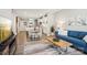 Open-concept living area seamlessly connects to the kitchen, featuring hardwood floors and abundant natural light at 6295 Ashton Park Dr, Denver, NC 28037