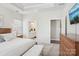 Serene main bedroom boasts plush carpet, tray ceilings, and an attached ensuite bathroom for added luxury at 6295 Ashton Park Dr, Denver, NC 28037