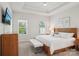 Relaxing main bedroom with a tray ceiling, natural light, and a wooden furniture set provides a cozy retreat at 6295 Ashton Park Dr, Denver, NC 28037
