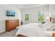 Cozy main bedroom with natural light, soft carpet, and wooden furniture promotes a tranquil atmosphere at 6295 Ashton Park Dr, Denver, NC 28037