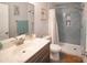 Well-lit bathroom with modern sink and shower featuring stylish blue subway tile at 6300 Bill Sain Rd, Vale, NC 28168