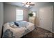 Comfortable bedroom with a soft bed, wood-look flooring, and a vintage-style vanity at 6300 Bill Sain Rd, Vale, NC 28168