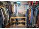 Organized walk-in closet featuring shelving and hanging rods for optimal storage space at 6300 Bill Sain Rd, Vale, NC 28168