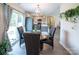 Open concept dining room with wood floors, a chandelier, and easy access to kitchen and outdoors at 6300 Bill Sain Rd, Vale, NC 28168