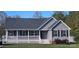 Charming single-story home with a welcoming front porch, black shutters, and landscaped lawn at 6300 Bill Sain Rd, Vale, NC 28168