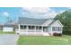 Charming home with a covered front porch, a storage shed on a spacious yard at 6300 Bill Sain Rd, Vale, NC 28168