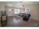 Bright living room featuring a sofa, recliner, and vaulted ceilings at 6300 Bill Sain Rd, Vale, NC 28168