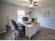Functional home office with large desk, ergonomic chair, and natural light at 6300 Bill Sain Rd, Vale, NC 28168
