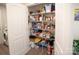 Pantry with shelving stocked with food and household items, providing ample storage space at 6300 Bill Sain Rd, Vale, NC 28168