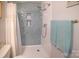Modern shower features blue tile, built-in shelving and is equipped with a rainfall shower head at 6300 Bill Sain Rd, Vale, NC 28168