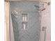 Modern shower features stylish blue herringbone tile, a rainfall shower head, and recessed shelving at 6300 Bill Sain Rd, Vale, NC 28168
