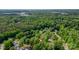 A residential area surrounded by dense trees, providing shade and natural beauty to create a peaceful, secluded community at 709 Weldon Ln, Salisbury, NC 28146