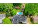 Aerial view of the home showcasing the pool, lush landscaping, and roof at 709 Weldon Ln, Salisbury, NC 28146