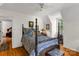 Charming bedroom featuring a four-poster bed and a window with natural light at 709 Weldon Ln, Salisbury, NC 28146