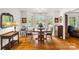 The dining room features natural light, wood floors, and a chandelier at 709 Weldon Ln, Salisbury, NC 28146