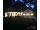 Inviting home exterior illuminated at night, showcasing the well-lit porch and garage at 709 Weldon Ln, Salisbury, NC 28146
