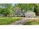 Inviting front exterior featuring a well-maintained lawn, driveway, and a charming facade at 709 Weldon Ln, Salisbury, NC 28146