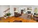 Comfortable living room with fireplace, hardwood floors, and a ceiling fan at 709 Weldon Ln, Salisbury, NC 28146