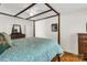 Main bedroom features a four-poster bed, hardwood floors, and traditional furnishings at 709 Weldon Ln, Salisbury, NC 28146