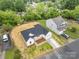 A high-angle view showcases a white, single-story home and its surrounding neighborhood at 722 English St, Monroe, NC 28110