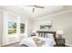 Bright primary bedroom with large windows, stylish bedding, and a serene ambiance at 722 English St, Monroe, NC 28110