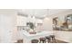 Modern kitchen featuring sleek white cabinetry, a stylish island, and stainless steel appliances at 722 English St, Monroe, NC 28110