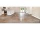 Open concept floor plan with access to outside via sliding glass doors and a view to the kitchen area at 722 English St, Monroe, NC 28110