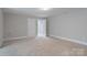 Large finished basement area features neutral carpet and paint at 7358 Bay Cove Ct, Denver, NC 28037