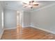 Bedroom with hardwood floors, neutral walls, and ceiling fan at 7358 Bay Cove Ct, Denver, NC 28037