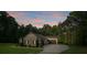 Beautiful single-story home featuring an attached garage, lush lawn, and meticulous landscaping at 7358 Bay Cove Ct, Denver, NC 28037