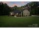 Attractive home with a manicured lawn, landscaping, and inviting front porch at 7358 Bay Cove Ct, Denver, NC 28037