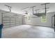 Garage featuring storage racks and windows at 7358 Bay Cove Ct, Denver, NC 28037